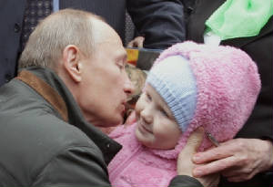 2011-01-03-12-27-26-10-russian-prime-minister-vladimir-putin-kissed-a-bab.jpeg.w300h205